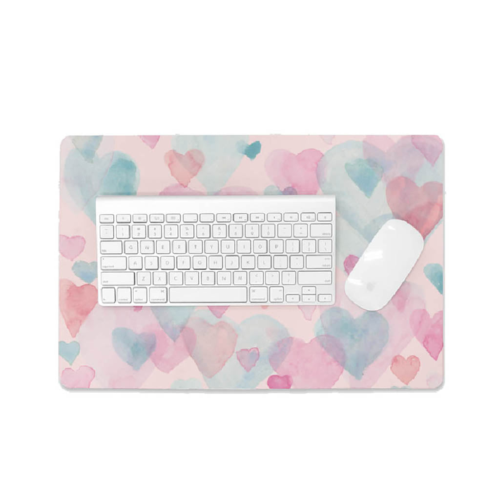 desk mat with watercolor hearts pattern and a keyboard and mouse on top of it