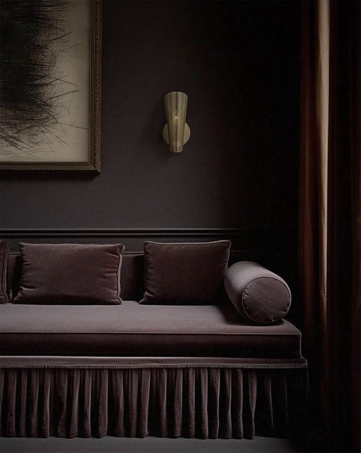 deep brown walls with tonal velvet sofa