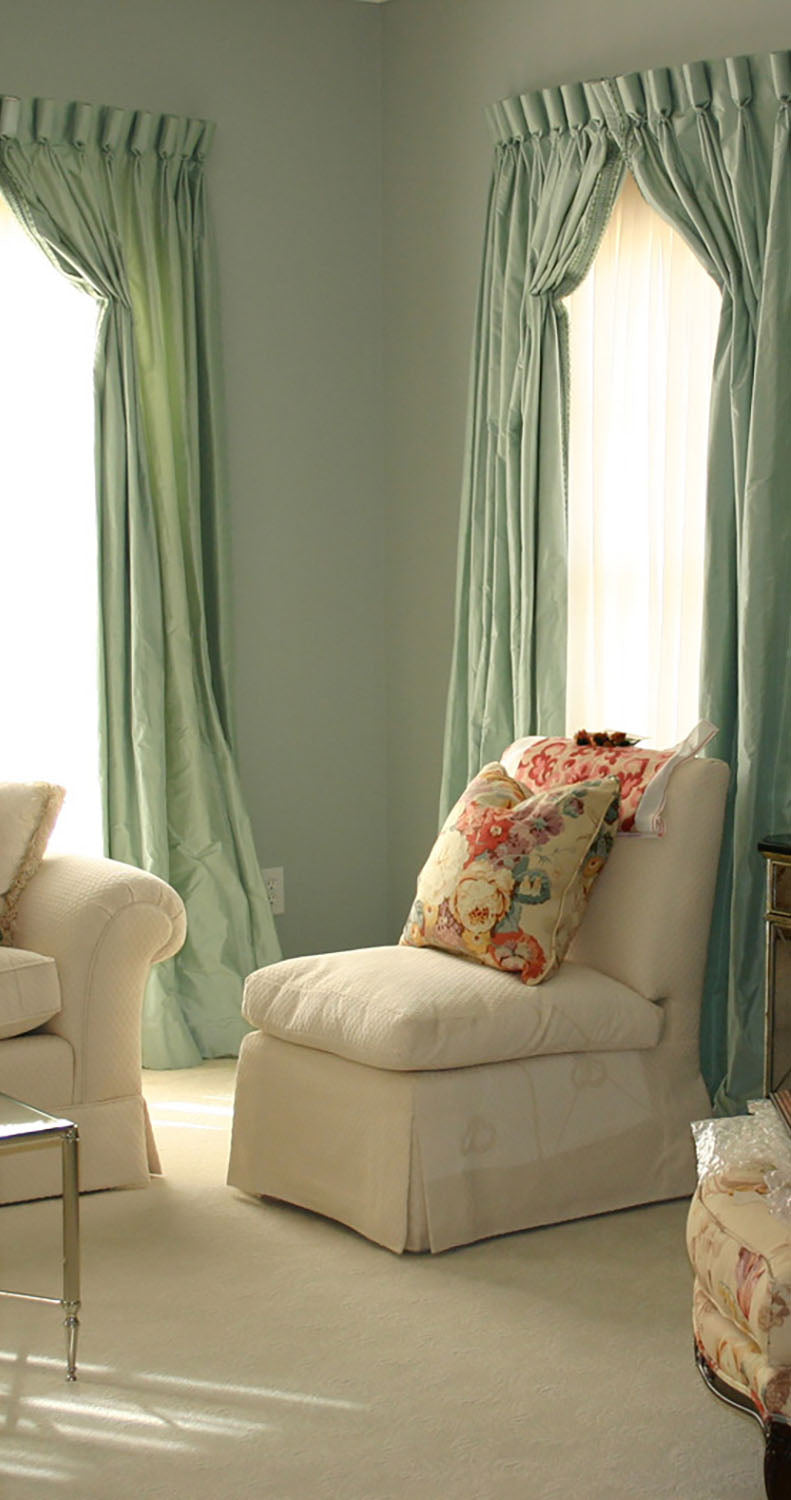 living room with aqua walls and drapery
