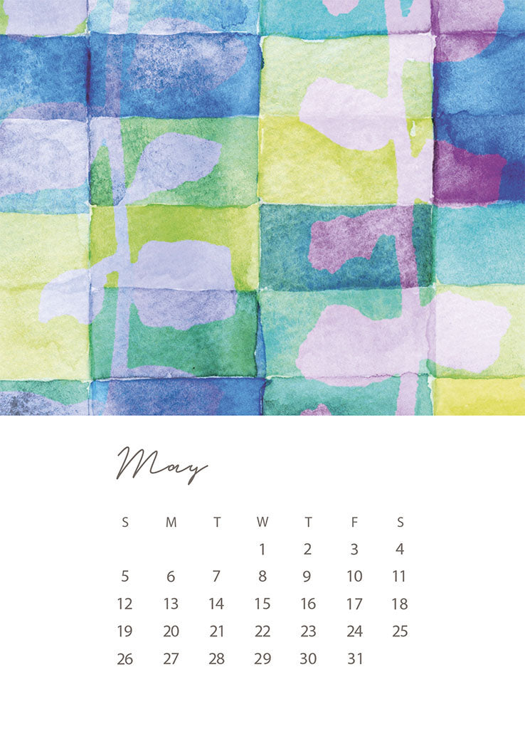 A 5x7 card with the days and dates for May 2024 at the bottom on a white background. The top half of the card is an illustration of watercolor leaves on bright colored squares by Jenny Bova.