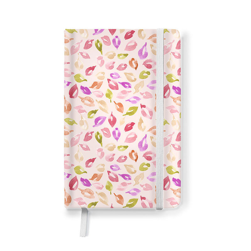 Hardcover journal with a pink and green leaf pattern