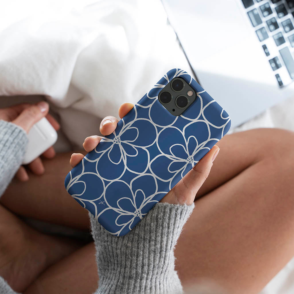 blue and white iphone case with simple graphic floral pattern