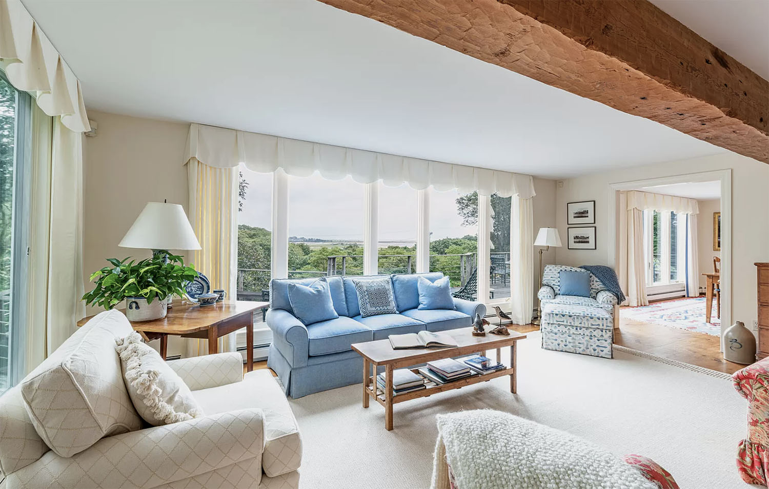 costal living room with antique beam