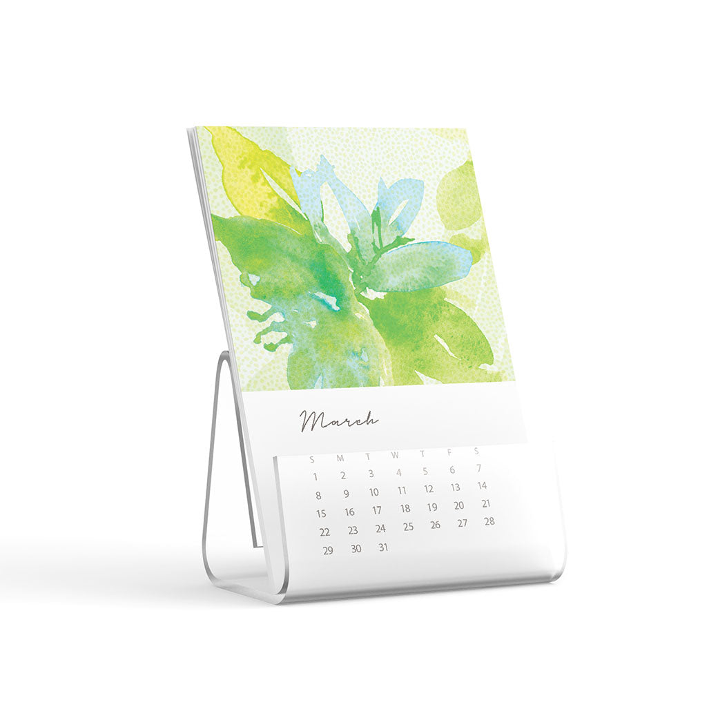 Tabletop calendar with a floral design on a white background