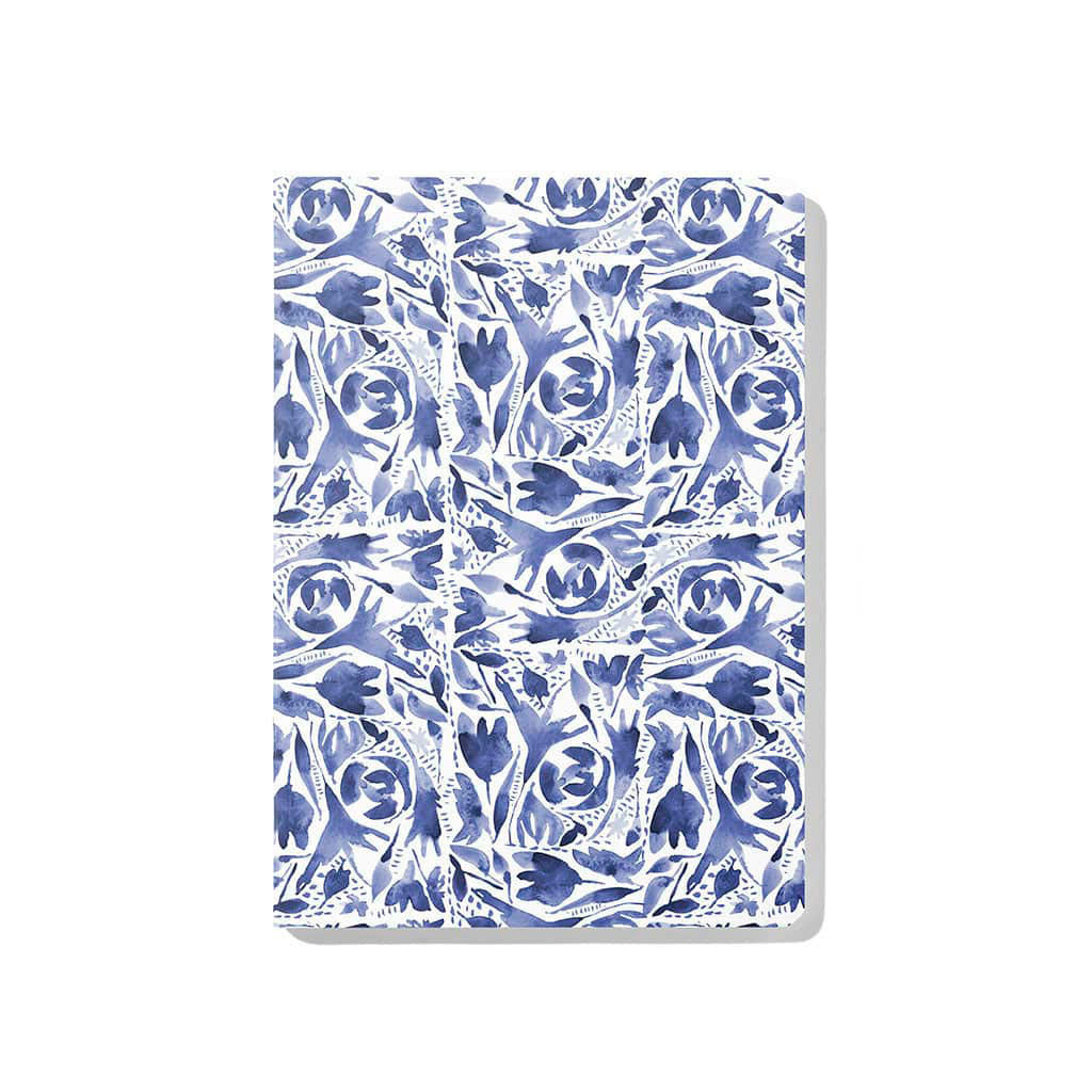 Front cover of Jenny Bova&#39;s Watercolor Indigo notebook featuring an abstract floral design in blue and white. 