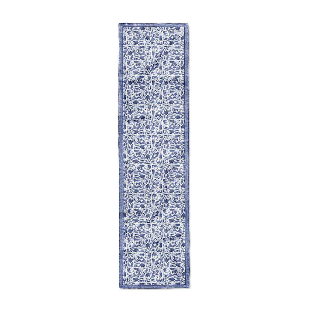 16x72 scarf with a blue and white floral pattern and deep blue border with white texture. 