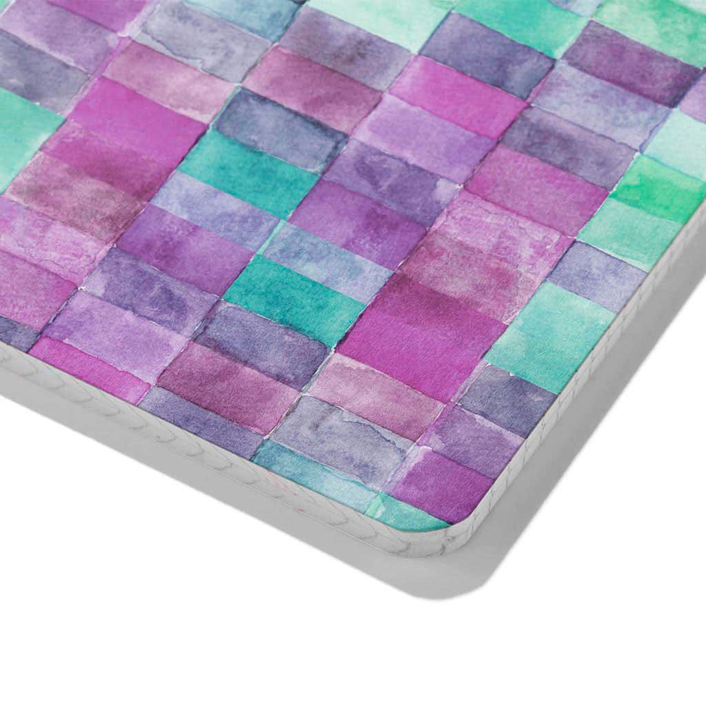 Zoomed in corner detail of Bijou Rectangles notebook. Cover is a rectangle watercolor pattern  with teal, pinks, purples, and greens.